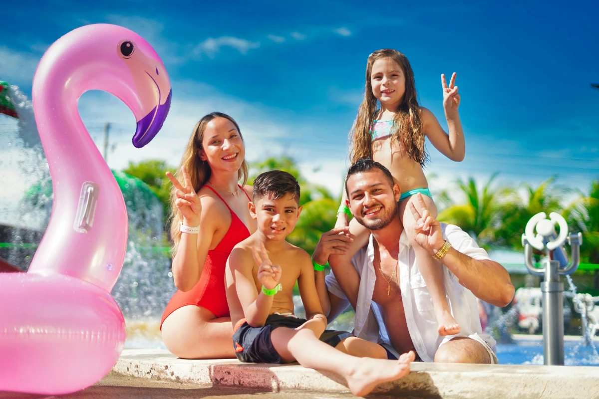 Cheerful girl enjoying a sunny beach vacation with friends in the sea