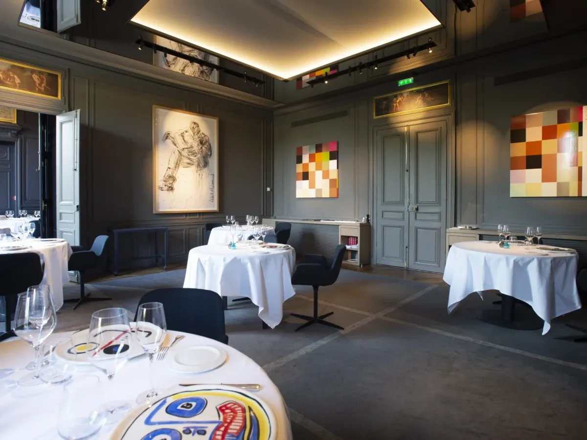 Luxury dining room interior with elegant furniture, tableware and lamp, in a home or hotel