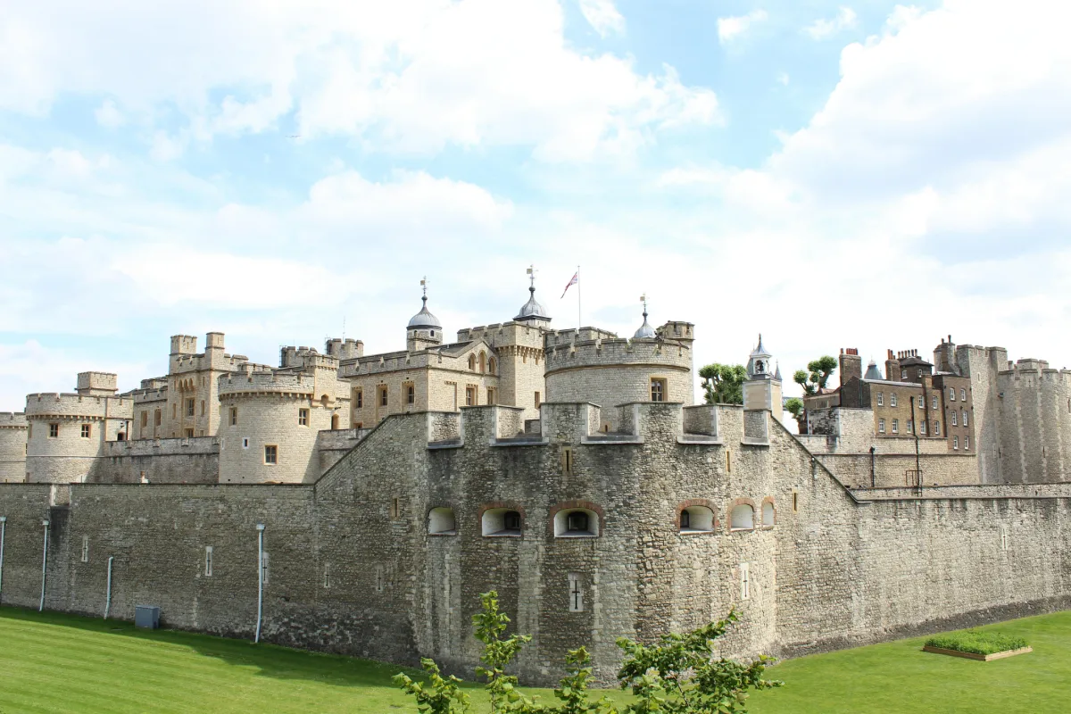 Ancient Gothic castle tower in a city, representing old military defence, under a clear sky