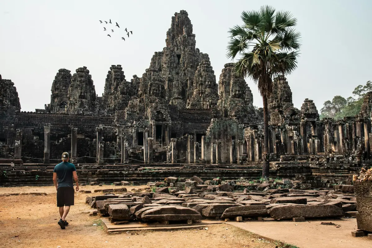 Ancient Buddha sculpture at a religious temple ruin, a popular travel destination for tourism and spirituality