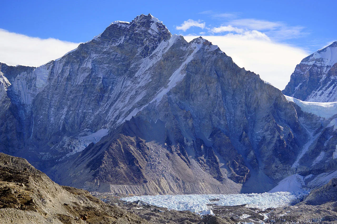 Stunning high altitude icy mountain peak in a winter landscape, perfect for hiking and adventure travel.